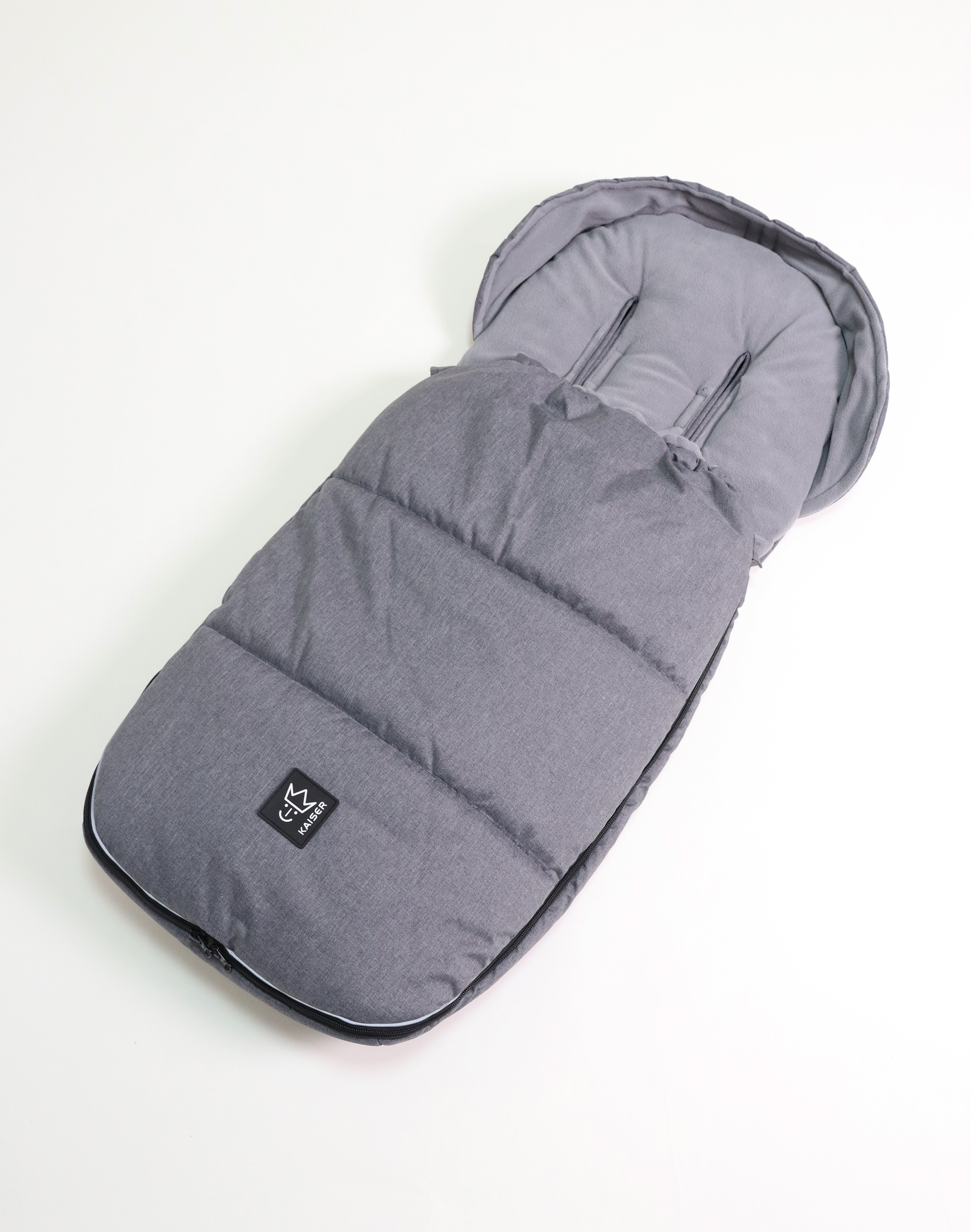 LUKKY - universal stroller footmuff Thermofußsack LUKKY in der Farbe black melange mit schwarzem Logo liegt quer