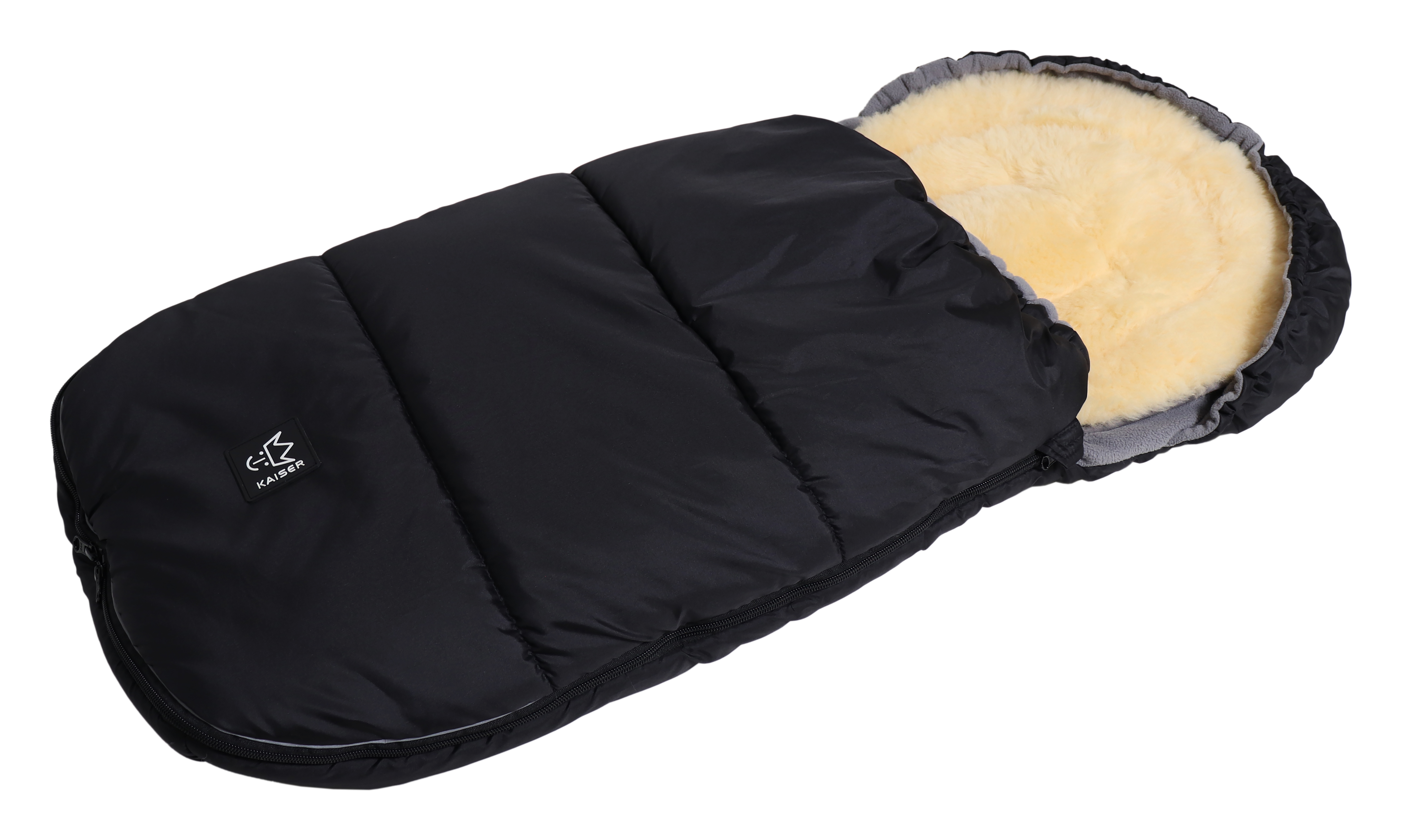 Thermofußsack aus Fleece in der Farbe black mit herausnehmbarer Schaffelleinlage liegt quer